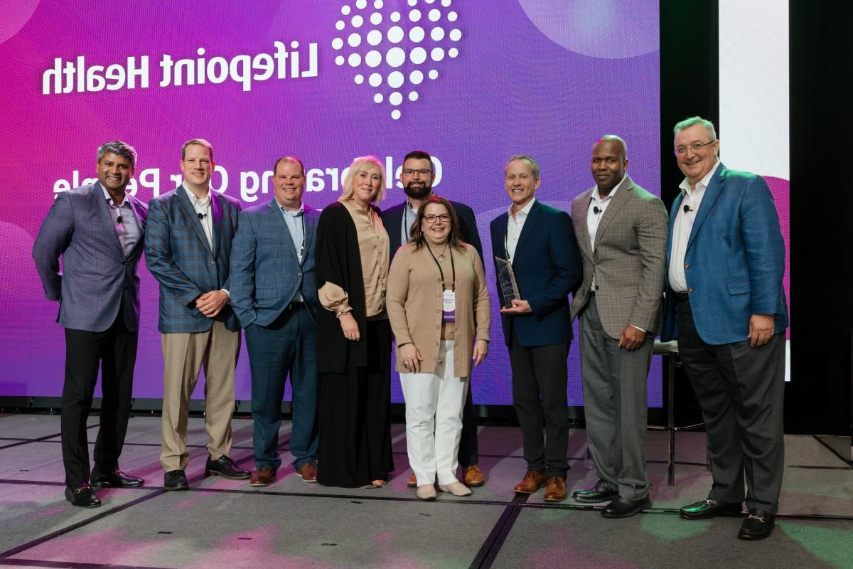 Frye Regional executive team onstage accepting the Lifepoint Health Growth Award for 2023